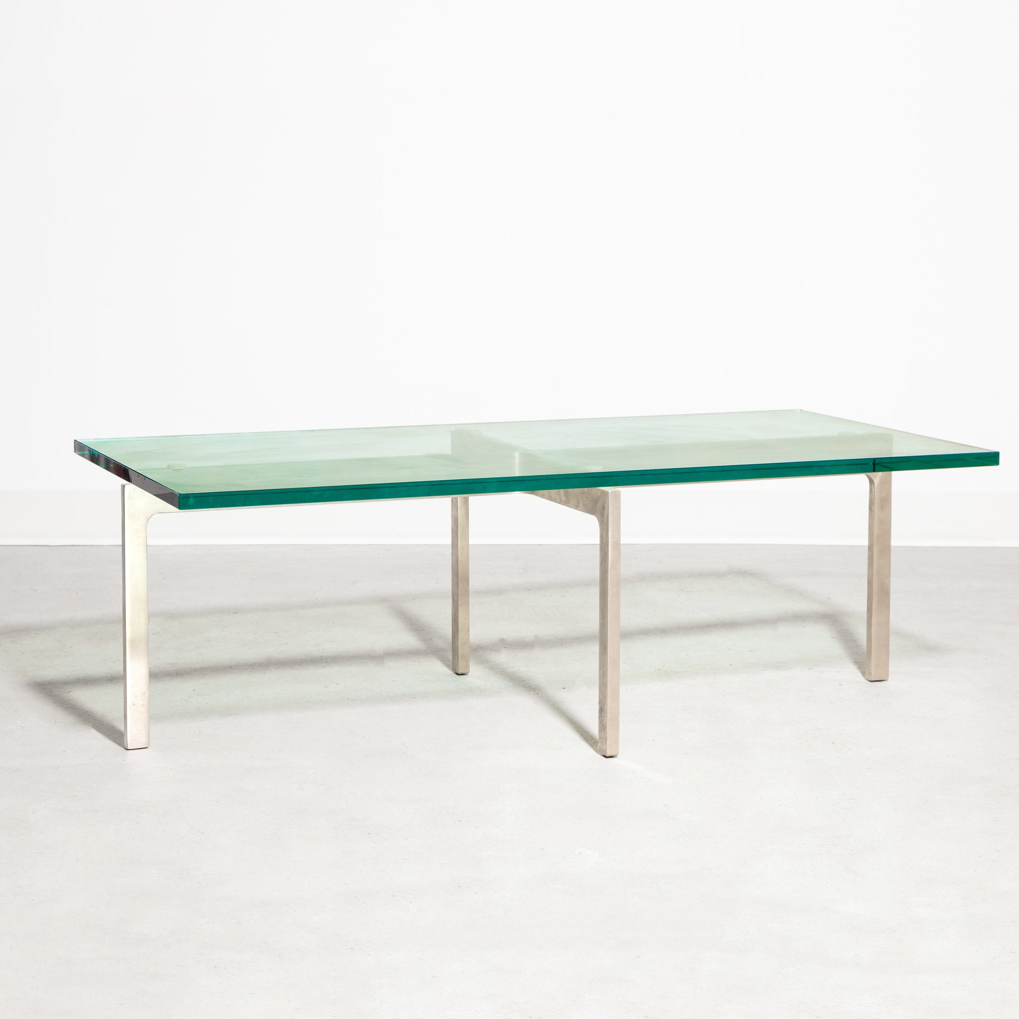 Keilhauer Glass Coffee Table with tempered glass top and steel base with nickel plated finish