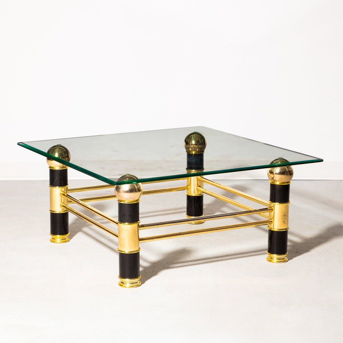 Vintage art deco coffee table. Glass with gold and lacquer finishes.