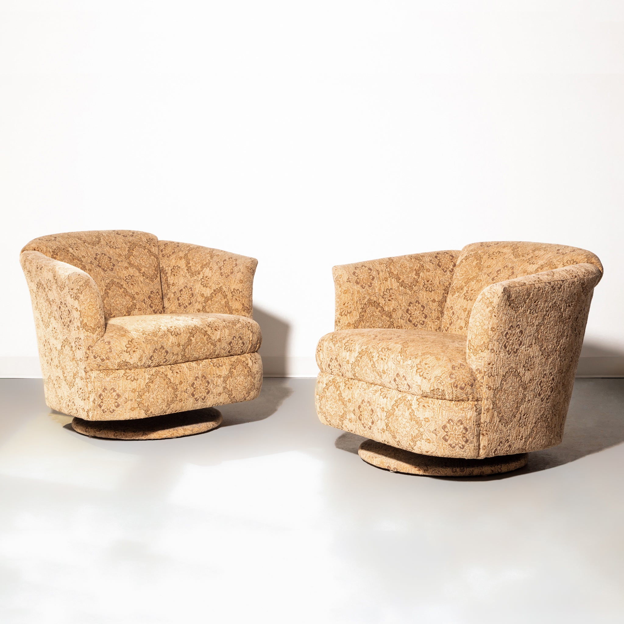 Pair of Textured Swivel Club Chairs