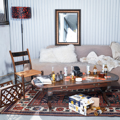 Living room with a coffee table, sofa, and decorative items.