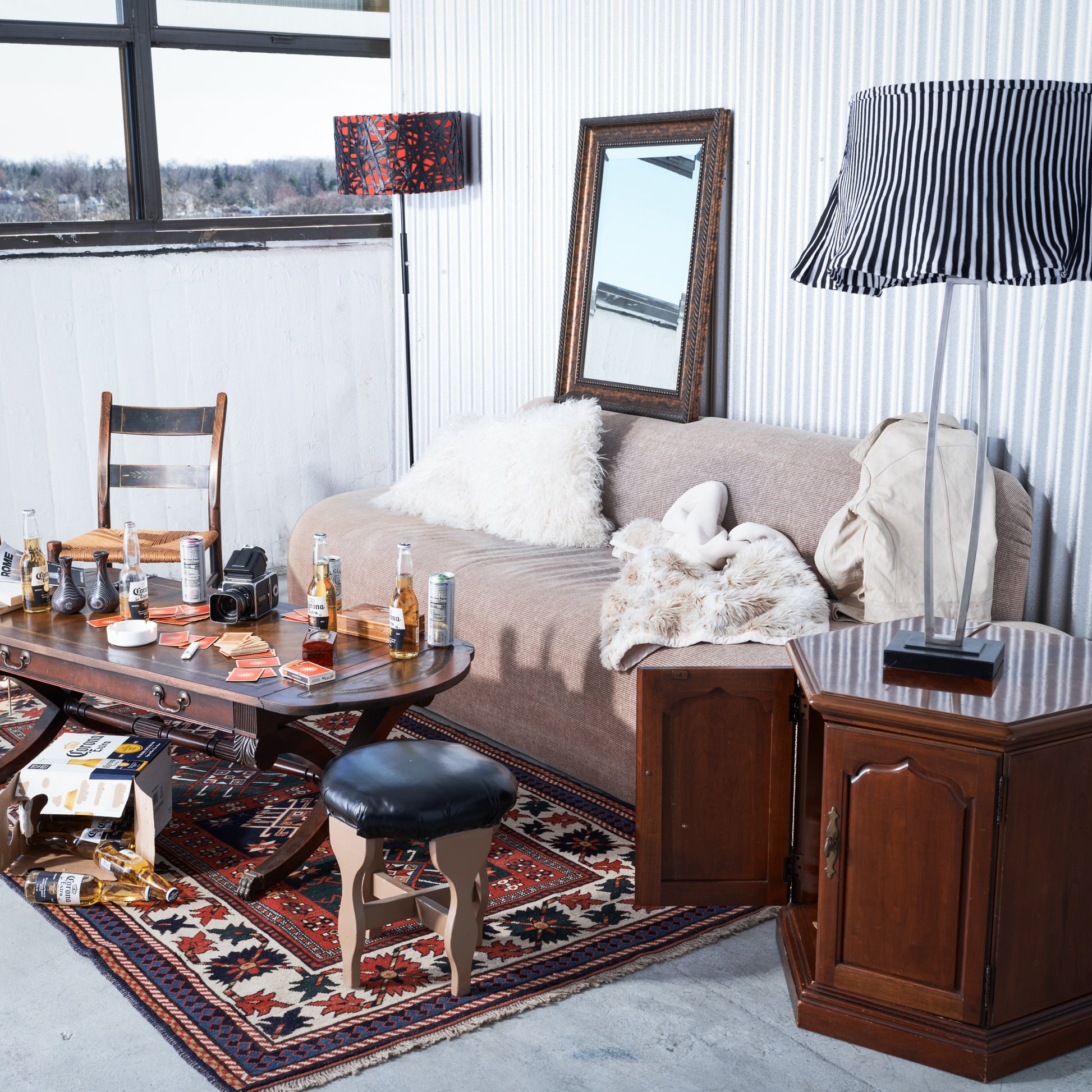 Living room with a couch, coffee table, and decorative items.