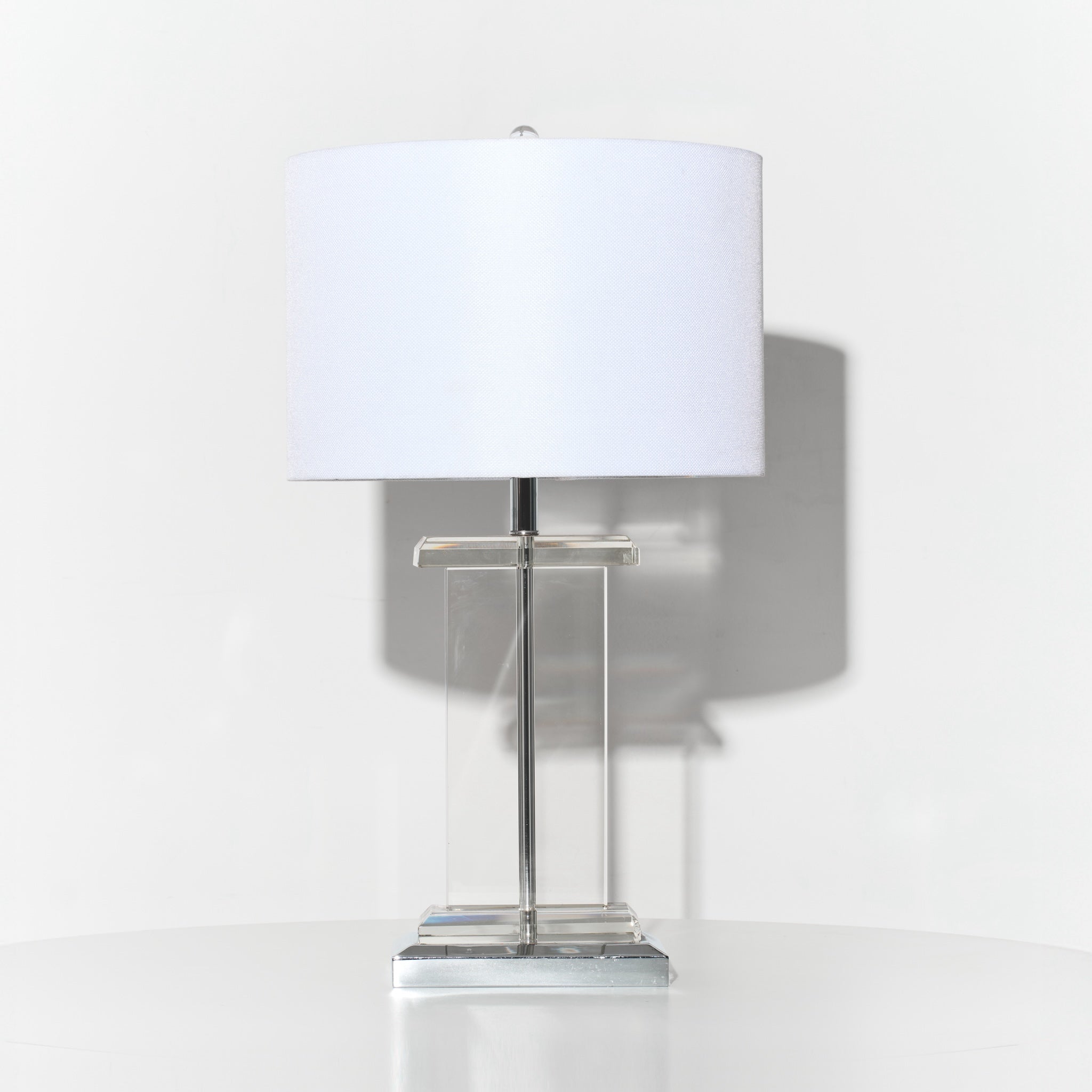 Table lamp with a white shade on a white background