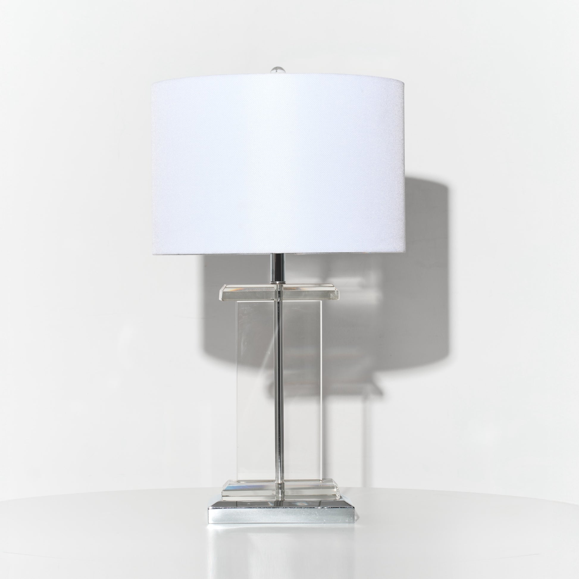 Table lamp with a white shade on a white background