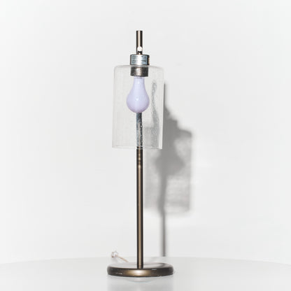 Decorative lamp with a purple bulb on a white background