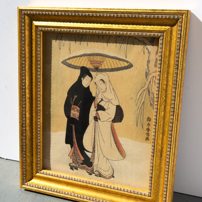 Framed artwork of two people under an umbrella on a beige background