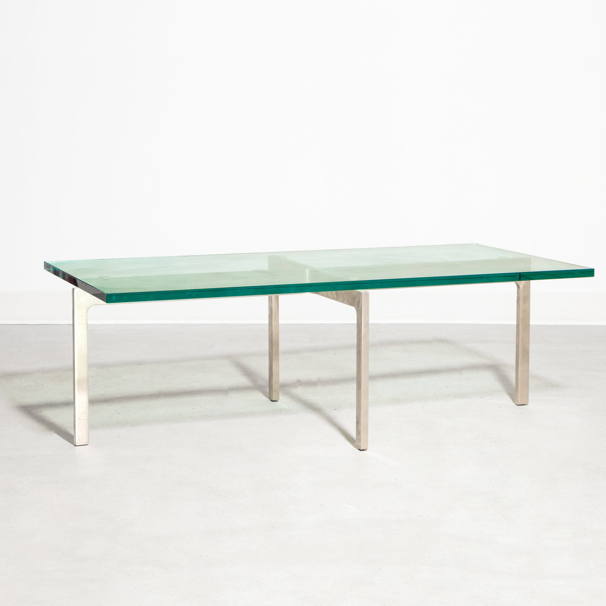 Keilhauer Glass Coffee Table with tempered glass top and steel base with nickel plated finish