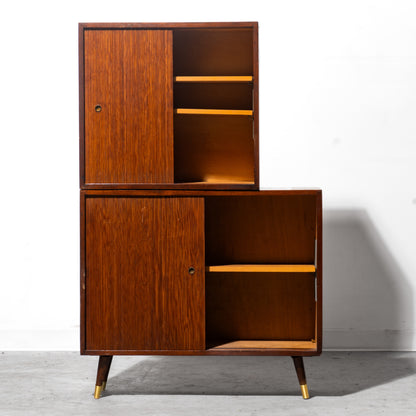 Wooden cabinet with open doors on a white background