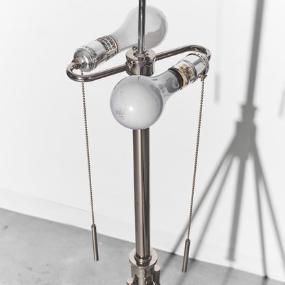 Metallic lamp with hanging light bulbs on a white background