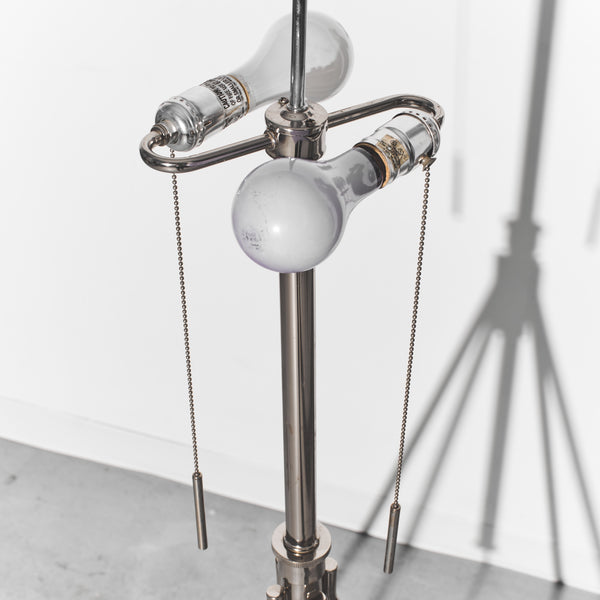 Metallic lamp with hanging light bulbs on a white background