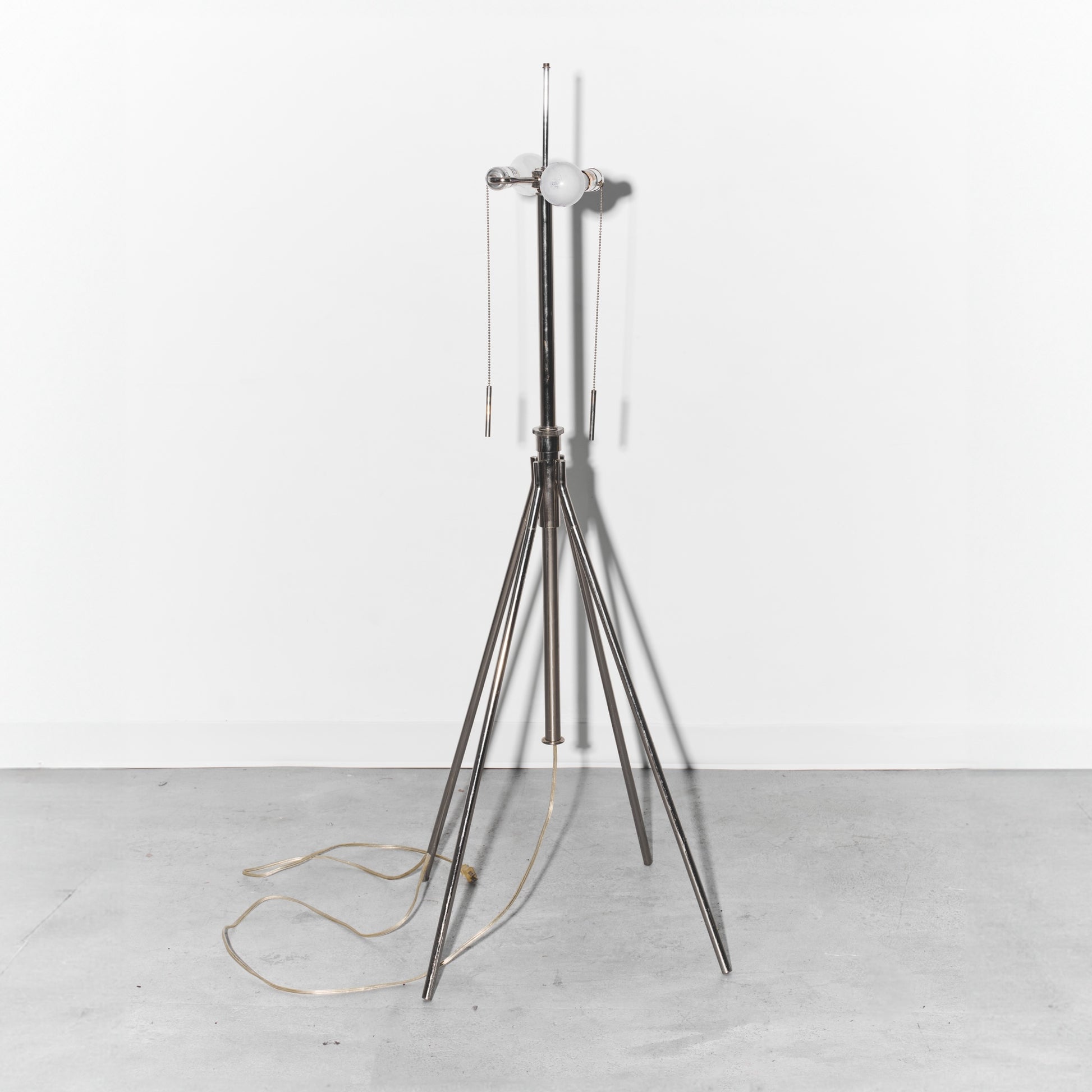 Floor lamp with a metallic stand on a white background