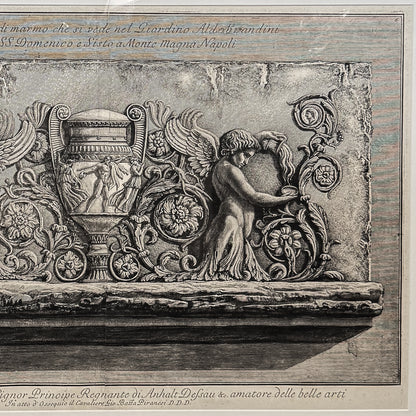 Decorative stone relief with angel and chariot on a wooden panel