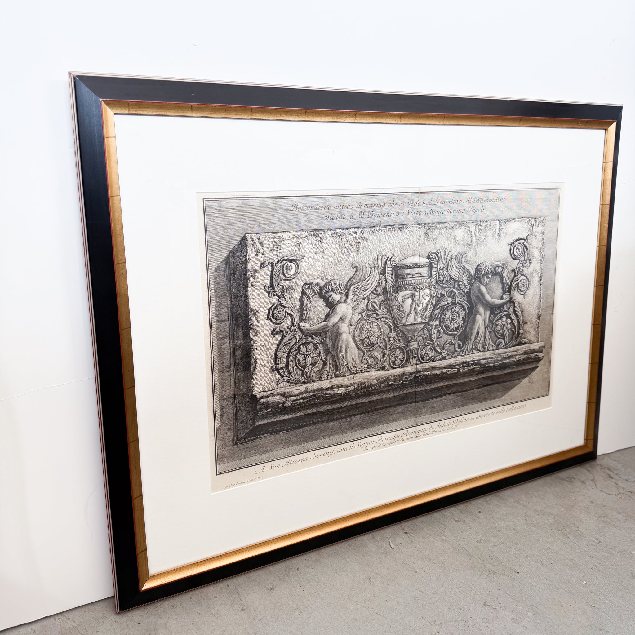 Framed black and white artwork on a plain background