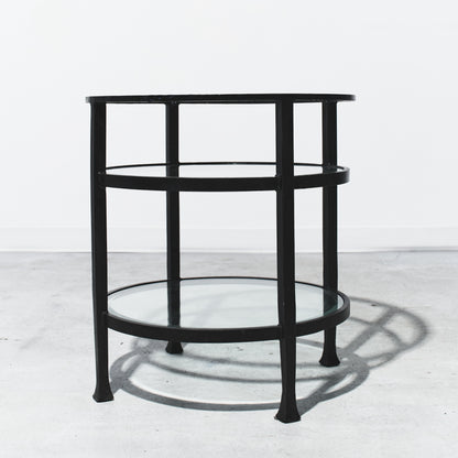 Black metal side table on a white background