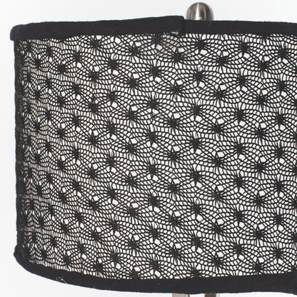 Black spider web pattern on a lampshade