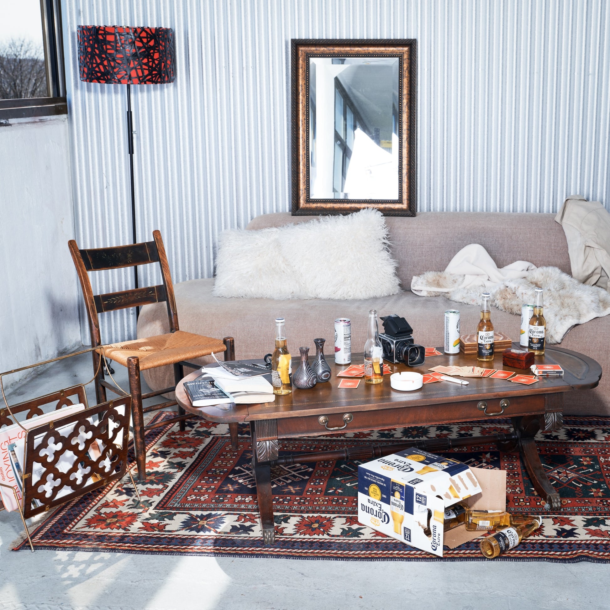 Living room with a coffee table, couch, and decorative items.