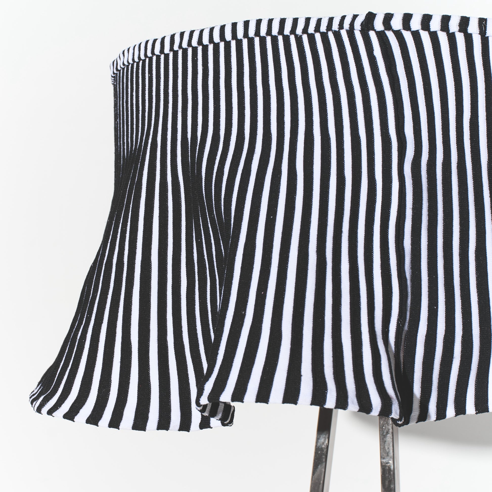 Black and white striped skirt on a white background