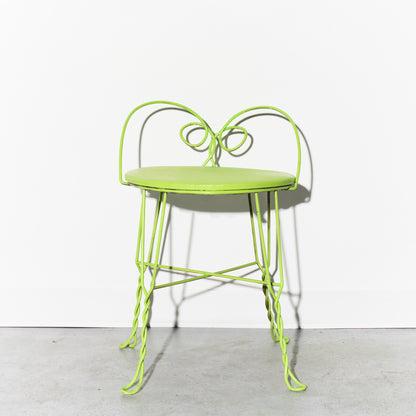 Green metal chair on a white background